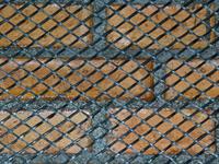 mesh reinforcing the brick wall